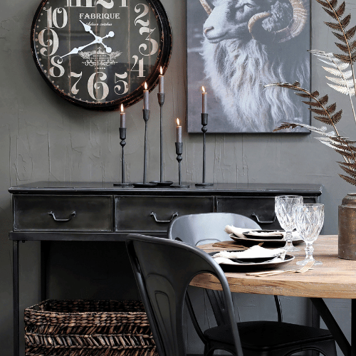 Antique Black Metal Candlesticks on Sideboard