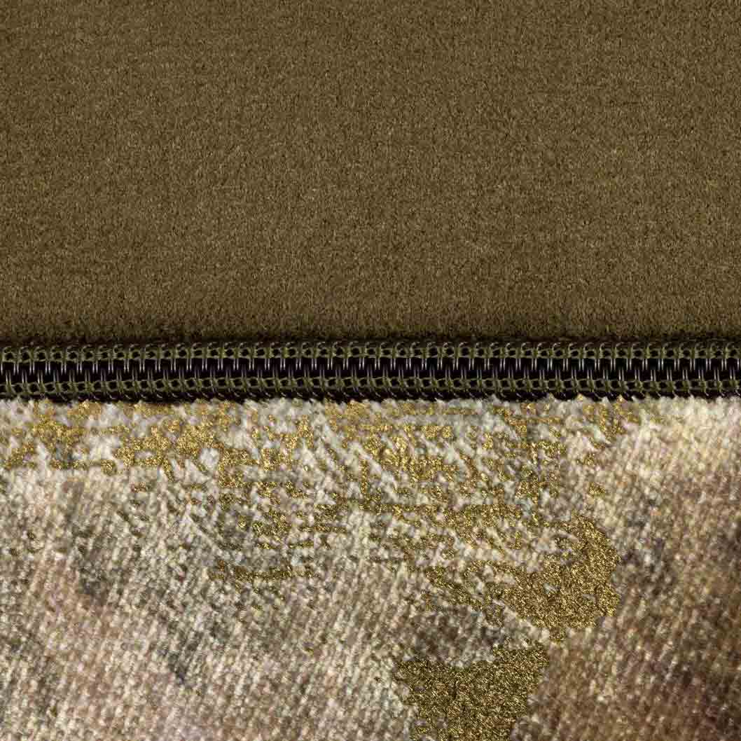 Close-up of the zip detailing on the Caesium Gold and Green Oblong Cushion, showing the high-quality craftsmanship.