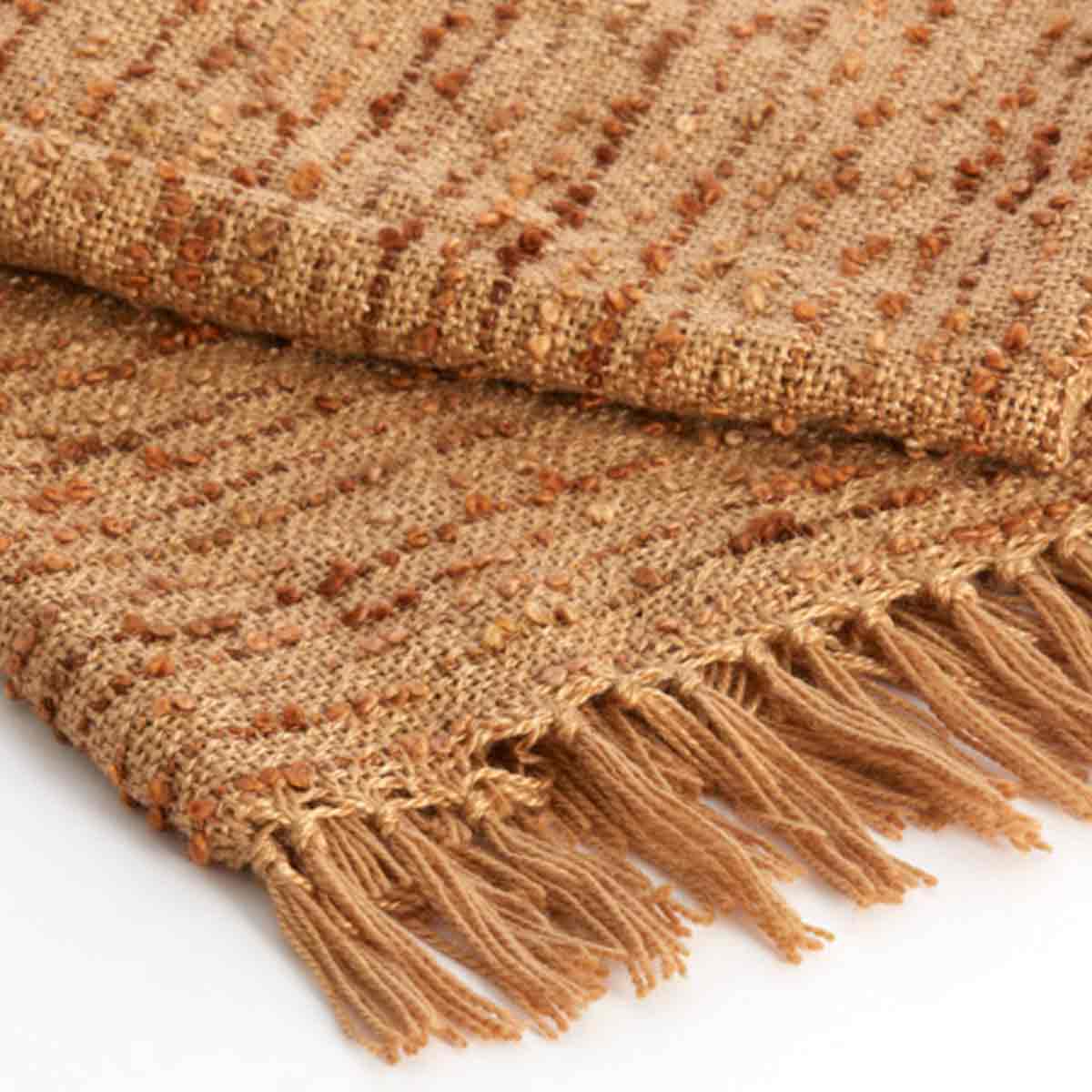 Folded Cazar Throw in rich brown - close up of fringed edges and textured design.