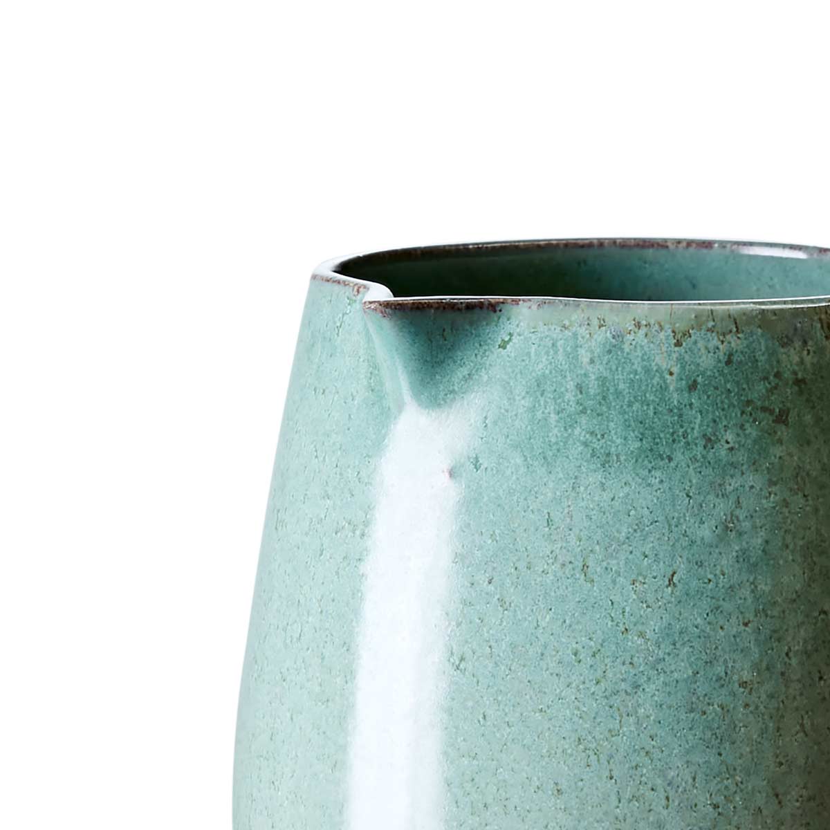 Close-up of Costa Stoneware Jug in Celadon Green, featuring rustic design and unique glaze variations