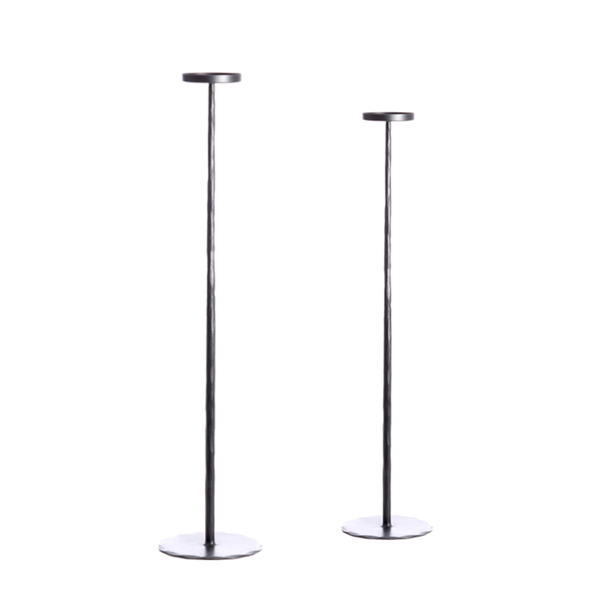 Esine Matt Black Candle Holders in two heights, featuring a minimal, textured design crafted from iron.