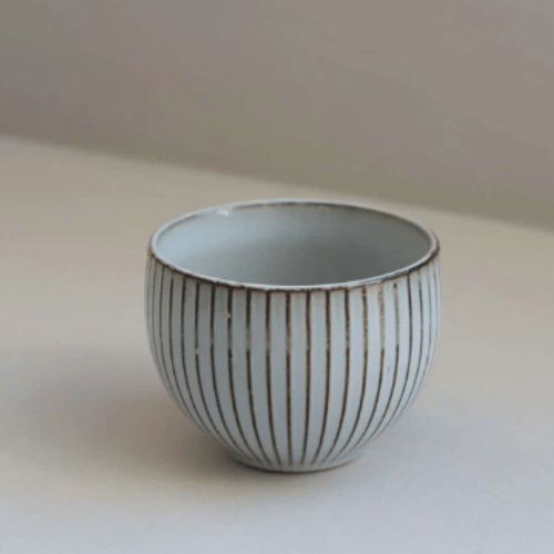 Small stripy bowl in olive