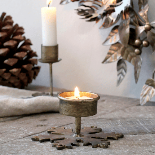 Snowflake tealight holder in antique brass