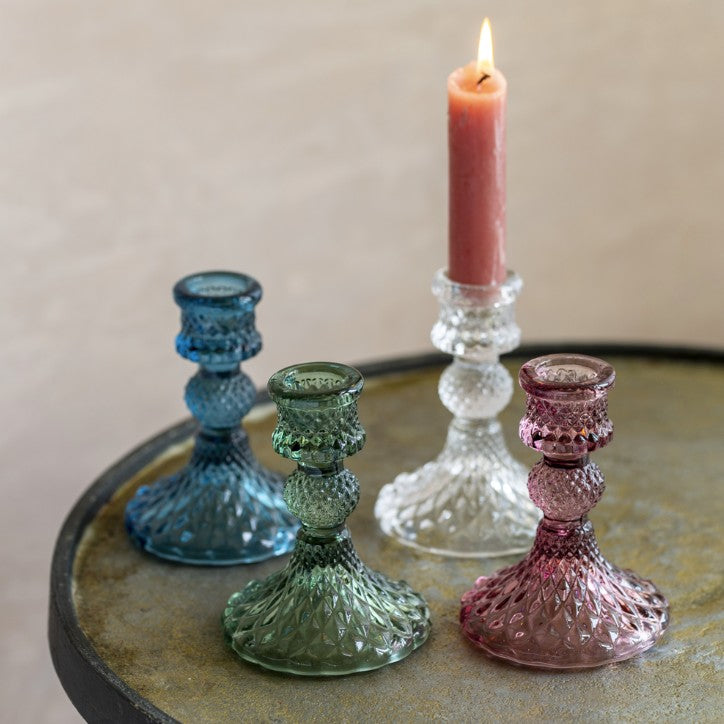 Collection of short glass candlesticks
