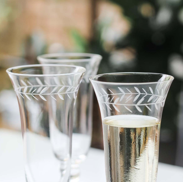 close up - champagne flutes etched leaves